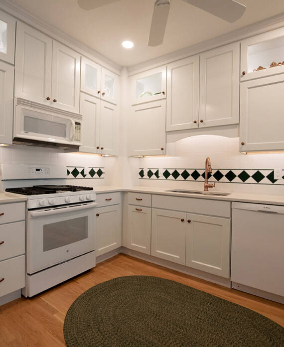 White kitchen remodel with copper and green accents in Colorado Springs
