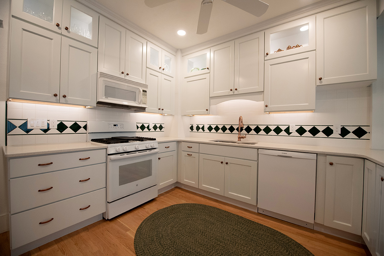 White kitchen remodel with copper and green accents in Colorado Springs