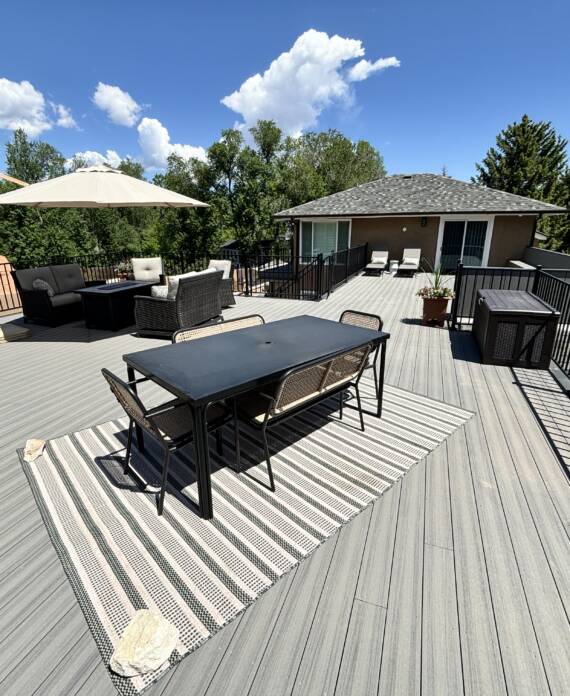 Colorado Springs composite deck featuring Deckorators Voyage decking in Tundra and Fortress Fe26 railing