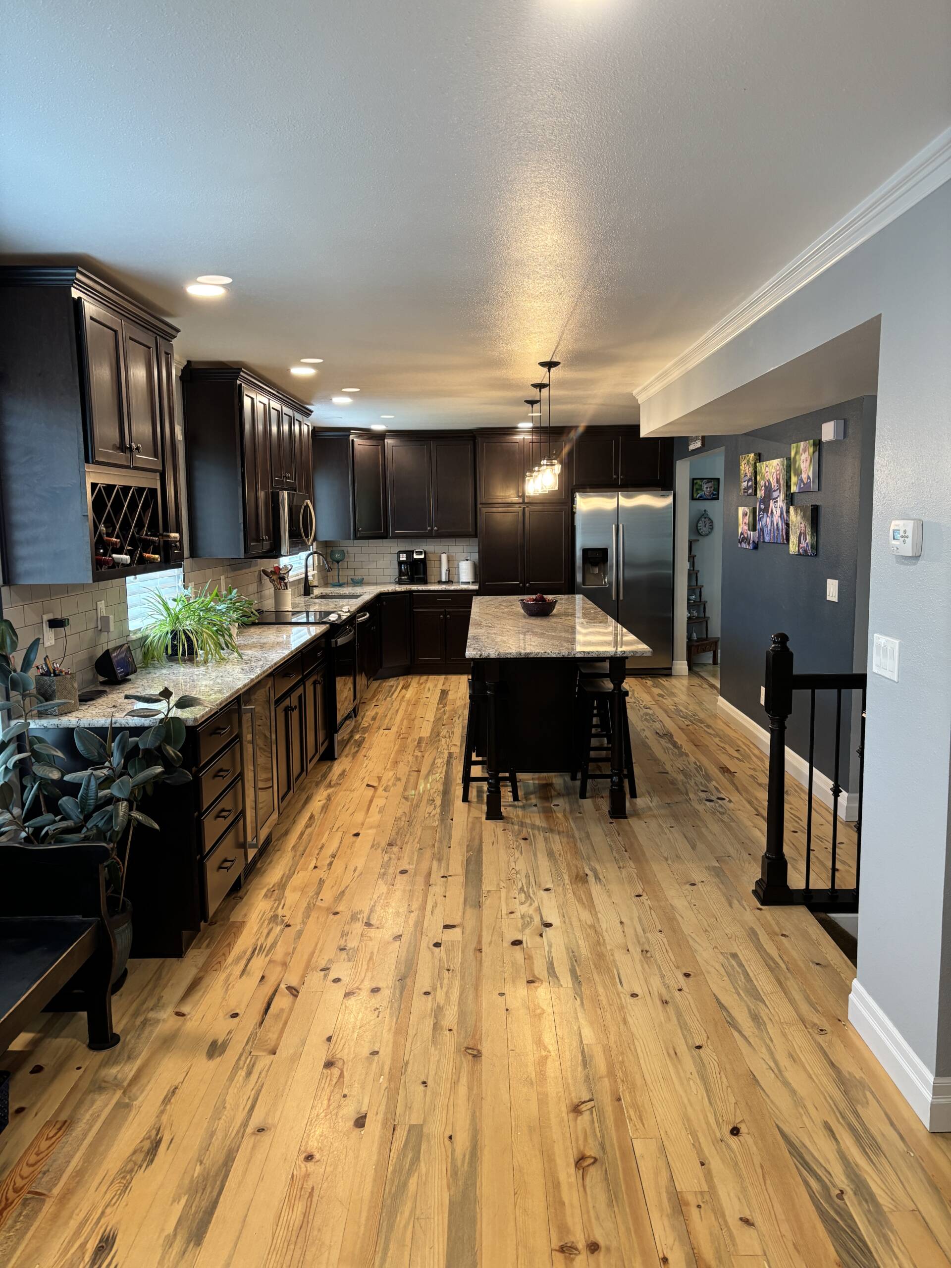 Kitchen remodel featuring Merillat cabinets in Kona with Nevaska granite countertops in Colorado Springs